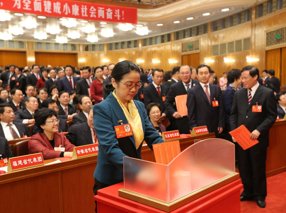 A delegate casts his ballot during the closing session of the 18th National Congress of the Communist Party of China (CPC) at the Great Hall of the People in Beijing, capital of China, Nov. 14, 2012. The congress started its closing session here Wednesday morning, at which a new CPC Central Committee and a new Central Commission for Discipline Inspection will be elected. (Xinhua/Yao Dawei)