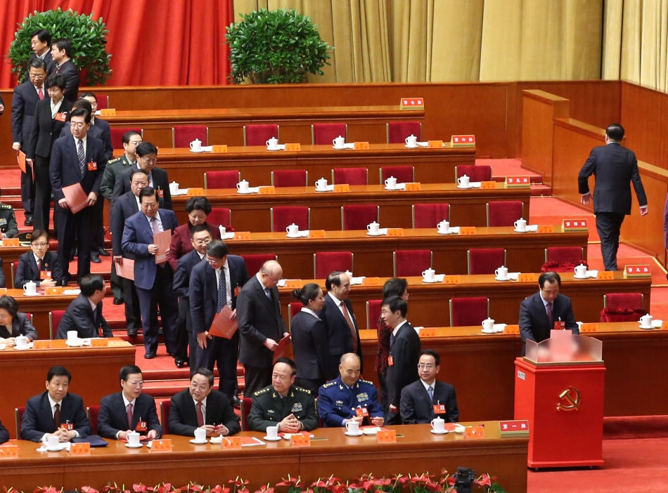 A delegate casts his ballot during the closing session of the 18th National Congress of the Communist Party of China (CPC) at the Great Hall of the People in Beijing, capital of China, Nov. 14, 2012. The congress started its closing session here Wednesday morning, at which a new CPC Central Committee and a new Central Commission for Discipline Inspection will be elected. (Xinhua/Yao Dawei)