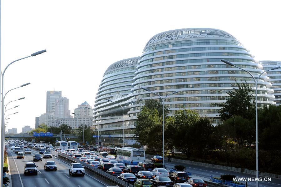 Photo taken on Nov. 14, 2012 shows the exterior of Galaxy Soho building in Beijing, capital of China. The newly-built building, desigened by Iraqi-British architect Zaha Hadid, is a 330,000-square-meter office, retail and entertainment complex. (Xinhua/Hu Qingming) 