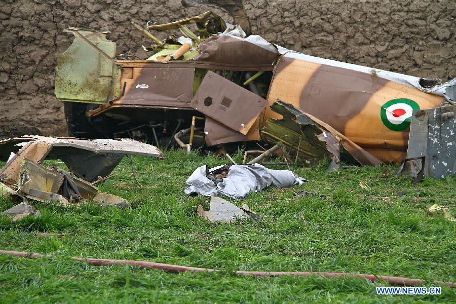 Debris of a helicopter is seen near Mashhad in northeastern Iran on Nov. 14, 2012. The death toll of a rescue helicopter crash in northeastern Iran Wednesday morning has increased to ten, semi-official Mehr news agency reported. (Xinhua/Hamed)