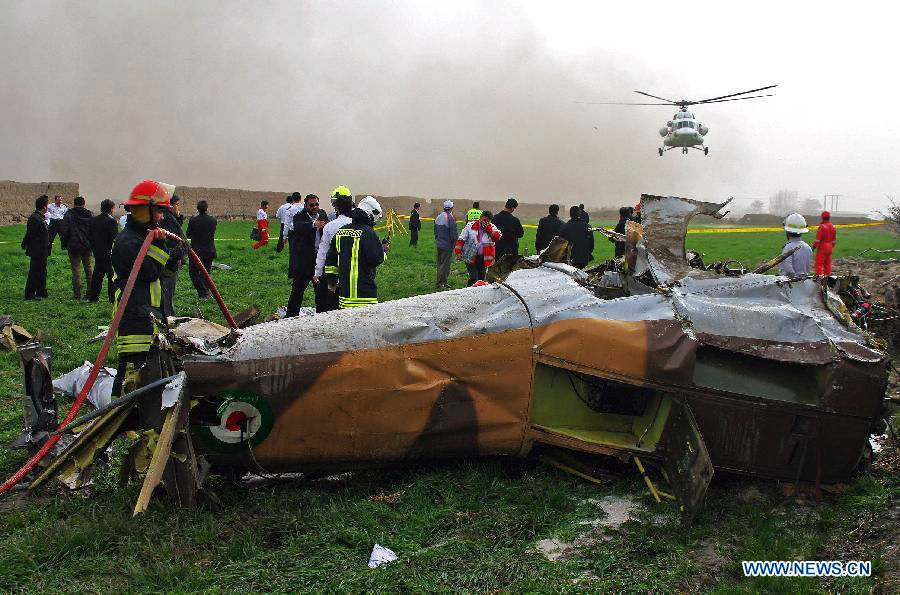 Rescuers are seen around debris of a helicopter near Mashhad in northeastern Iran on Nov. 14, 2012. The death toll of a rescue helicopter crash in northeastern Iran Wednesday morning has increased to ten, semi-official Mehr news agency reported. (Xinhua/Hamed)