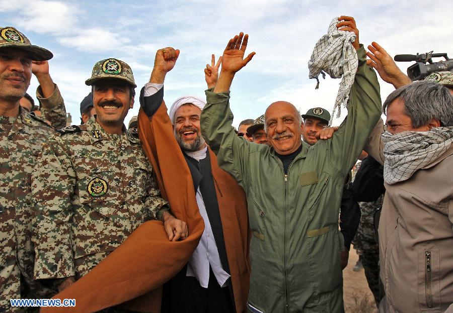 Iranian army members celebrate after successfully launching a surface-to-air missile during a military drill at an undisclosed location in Iran, on Nov. 14, 2012. Iran's Army and the Islamic Revolution Guards Corps have test-fired a range of missiles and unveiled their military achievements in the ongoing joint air defense drill starting on Monday. (Xinhua/Majid Asgaripour)
