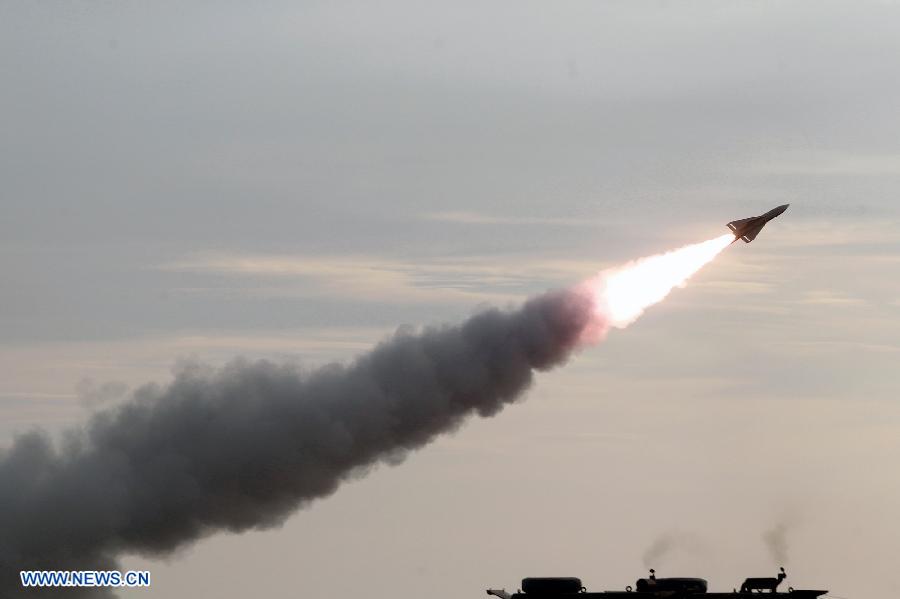 An Iranian surface-to-air missile is launched during a military drill at an undisclosed location in Iran, on Nov. 14, 2012. Iran's Army and the Islamic Revolution Guards Corps have test-fired a range of missiles and unveiled their military achievements in the ongoing joint air defense drill starting on Monday. (Xinhua/Majid Asgaripour)