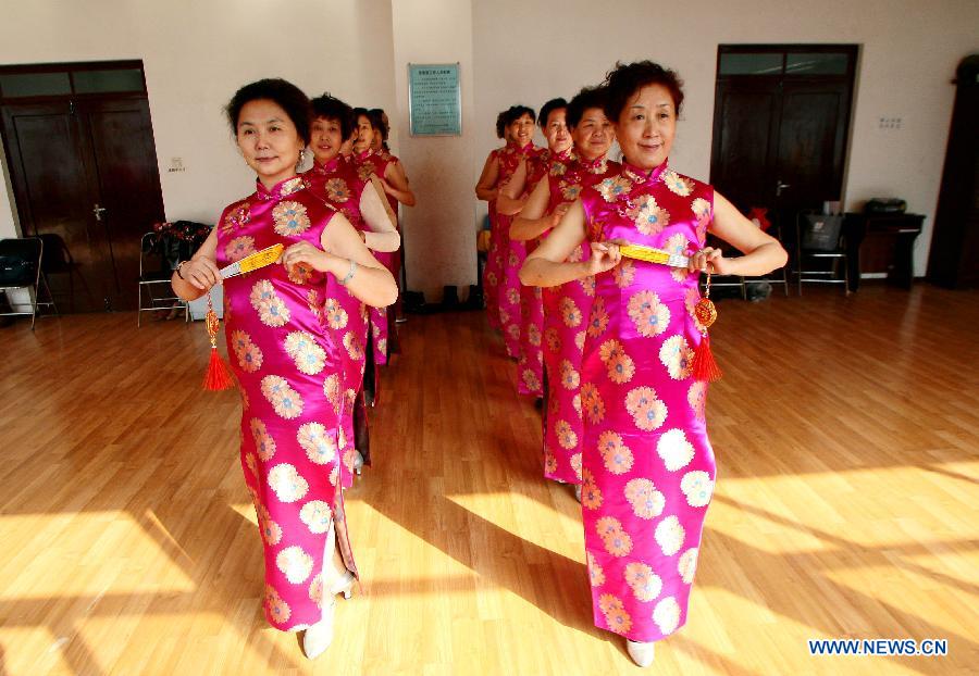 Members of an elder model team practise in Lanzhou, capital of northwest China's Gansu Province, Nov. 14, 2012. The elder model team that has 26 models with an average age of 62 is preparing for Gansu's 6th Elder Model Pageant that is to be held on Saturday. (Xinhua/Lu Yang) 