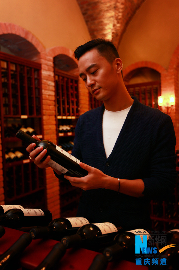 Bie chooses his favorite wine from cellar in Chen Cheng Mansion in Chongqing on Oct. 24, 2012.