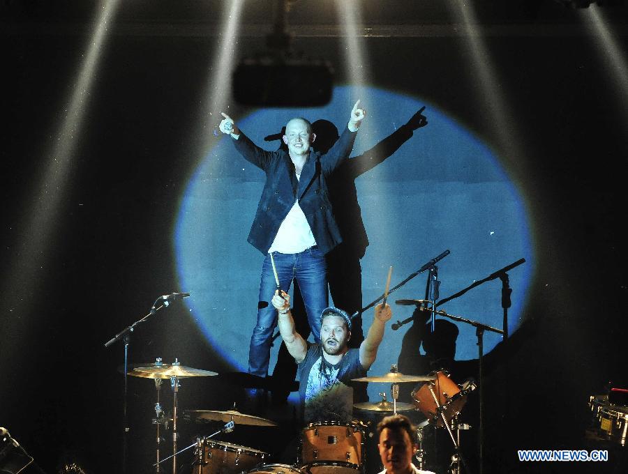 Lead vocals and piano Isaac Slade (Back) and drummer Ben Wysocki of American piano rock band "The Fray" perform during a concert at Tango Club in Beijing, capital of China, Nov. 14, 2012. The band was formed in 2002 and featured by the use of the piano as the lead instrument in their music. (Xinhua/Xiao Xiao)