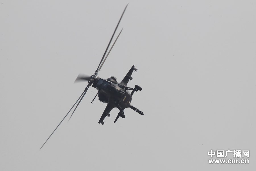 A WZ-10 attack helicopter practices on the first day of Airshow China 2012, which kicked off in south China’s Zhuhai on Nov. 13, 2012, after its first public appearance on Nov. 11, 2012. WZ-10, nicknamed China’s “Apache”, is the most advanced attack helicopter of the PLA and also the most expected Chinese aircraft at the Airshow China 2012. (CNR/Xu Ao)