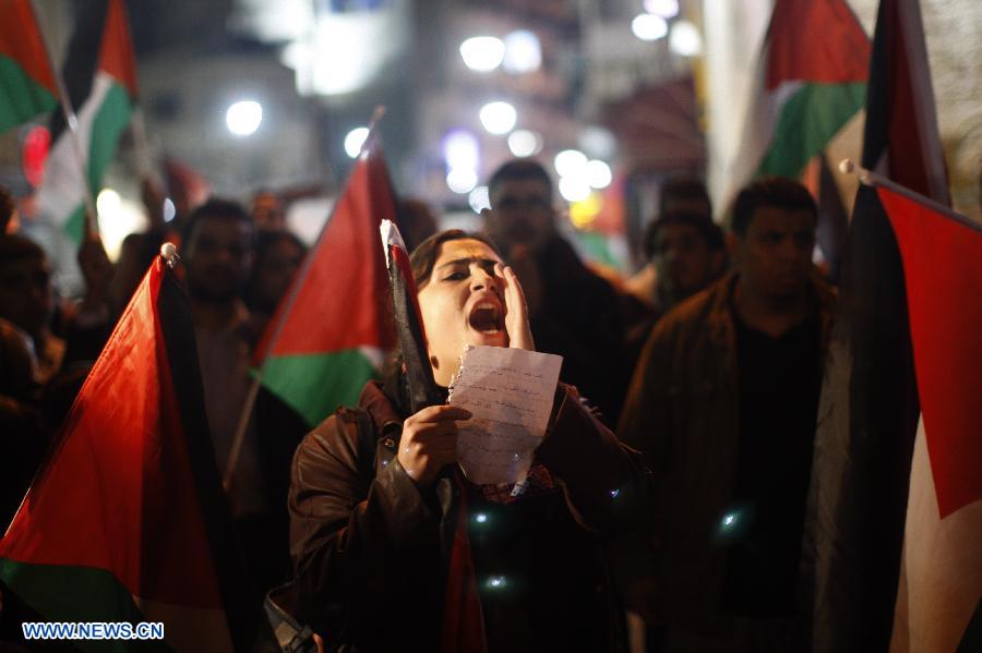 A Palestinian man takes part in a protest in the West Bank city of Ramallah against Israeli airstrikes on the Gaza Strip, Nov. 14, 2012. Several Palestinians were killed following a series of Israel's concurrent airstrikes on Gaza city, among them was Ahmed al-Jaabari, top commander of Hamas armed wing Al-Qassam brigades, and more than 40 others wounded, government's emergency services in the Gaza Strip said. (Xinhua/Fadi Arouri)