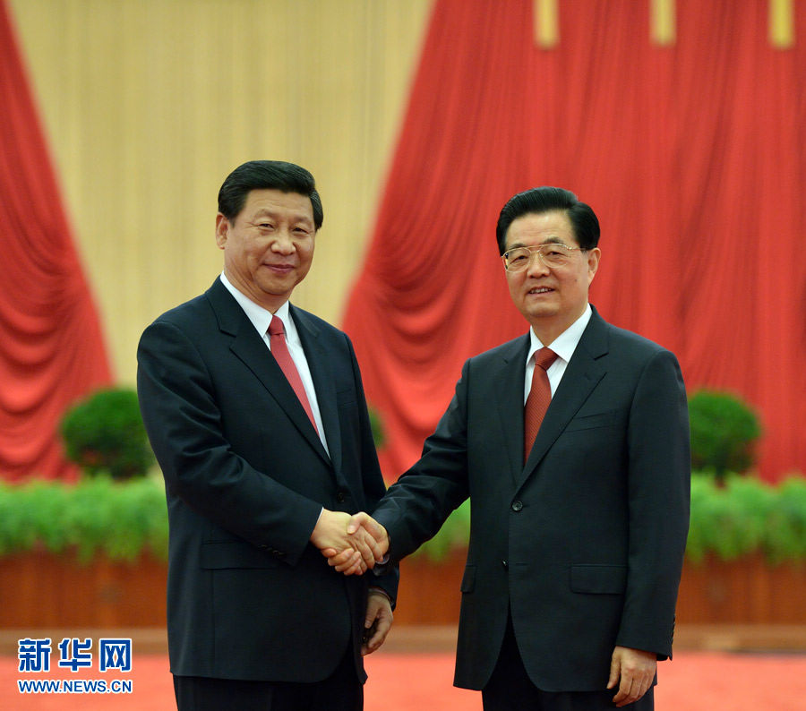 Chinese President Hu Jintao (R) shakes hands with newly-elected General Secretary of the Communist Party of China (CPC) Central Committee and Chairman of the CPC Central Military Commission Xi Jinping as they meet with delegates, special delegates and observers to the recently concluded 18th CPC National Congress, in Beijing, capital of China, Nov. 15, 2012. (Xinhua)