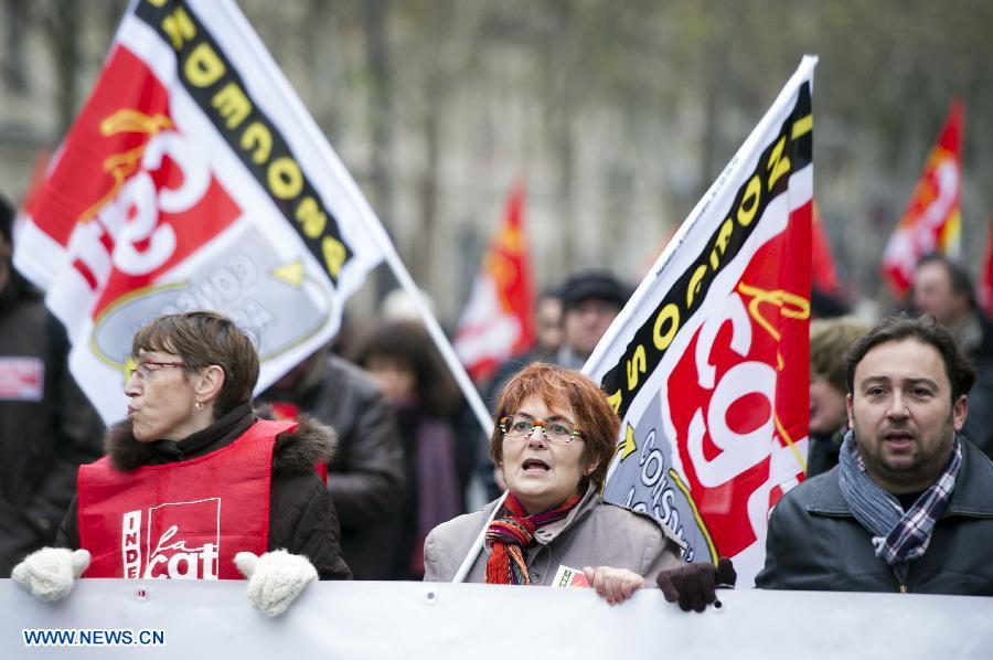 People attend a demonstration called by French trade unions, in Paris, France, Nov. 14, 2012. As part of the massive anti-austerity demonstration across Europe, thousands of French people took the streets on Wednesday to express their frustation over the austerity. (Xinhua/Etienne Laurent)