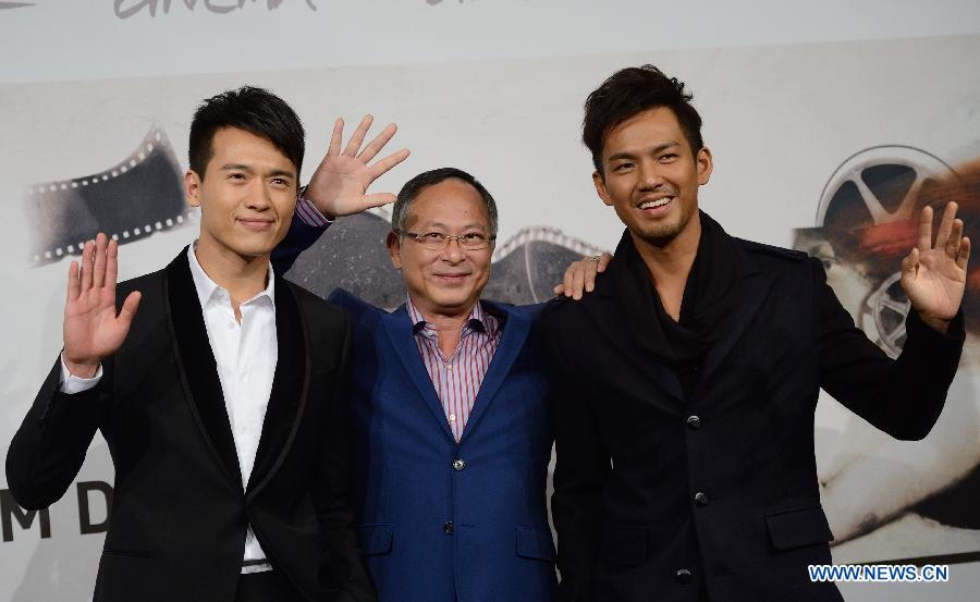 Director Johnnie To (C), together with actors Wallace Chung (R) and Gao Yunxiang, poses at the photo-call of the film "Drug War" at the 7th Rome Film Festival in Rome, capital of Italy, on Nov. 15, 2012. (Xinhua/Wang Qingqin)