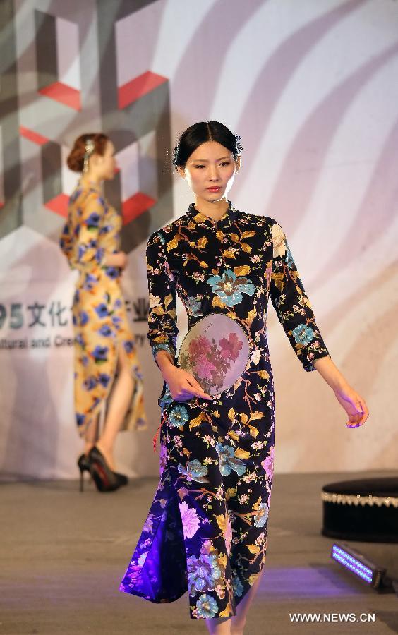 A model presents a cheongsam, a traditional Chinese women's dress also known as Qipao, at a cheongsam show in Nantong, east China's Jiangsu Province, Nov. 16, 2012. (Xinhua/Huang Zhe) 