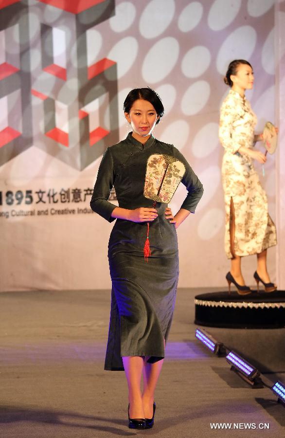 A model presents a cheongsam, a traditional Chinese women's dress also known as Qipao, at a cheongsam show in Nantong, east China's Jiangsu Province, Nov. 16, 2012. (Xinhua/Huang Zhe) 