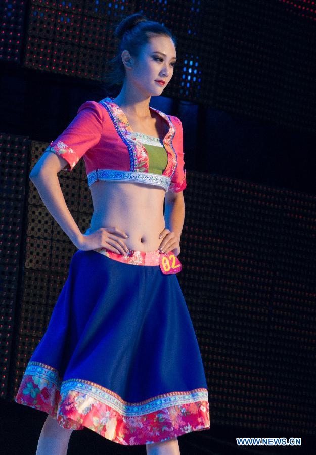 A model presents a creation during the 2012 She Ethnic Group Dress Design Competition in Jingning She Autonomous County, east China's Zhejiang Province, Nov. 17, 2012. The competition, with the aim to exploit the folk custom and ethnic costume of She Ethnic Group, attracted many contestants. (Xinhua/Li Suren) 