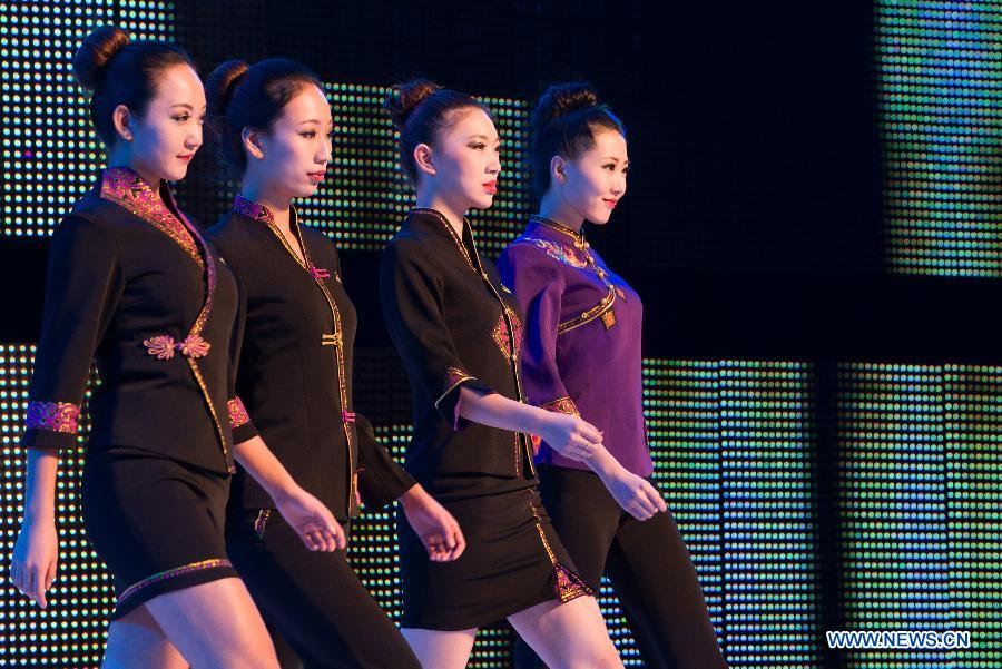 Models present creations during the 2012 She Ethnic Group Dress Design Competition in Jingning She Autonomous County, east China's Zhejiang Province, Nov. 17, 2012. The competition, with the aim to exploit the folk custom and ethnic costume of She Ethnic Group, attracted many contestants. (Xinhua/Li Suren) 