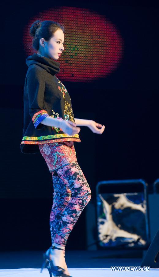 A model presents a creation during the 2012 She Ethnic Group Dress Design Competition in Jingning She Autonomous County, east China's Zhejiang Province, Nov. 17, 2012. The competition, with the aim to exploit the folk custom and ethnic costume of She Ethnic Group, attracted many contestants. (Xinhua/Li Suren) 