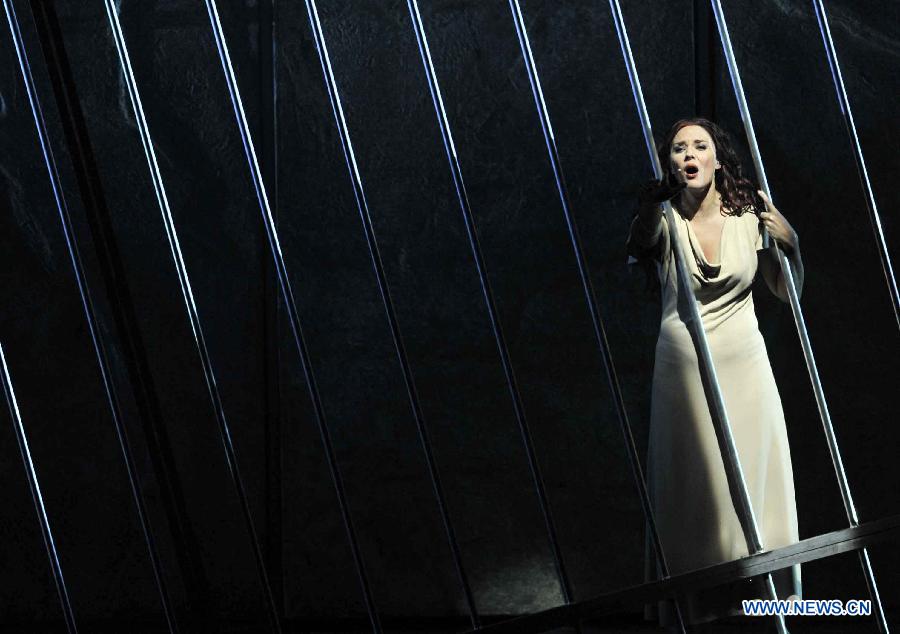 An actress performs during the musical Notre-Dame de Paris at Qingdao Grand Theatre in Qingdao, east China's Shandong Province, Nov. 18, 2012. (Xinhua/Li Ziheng) 