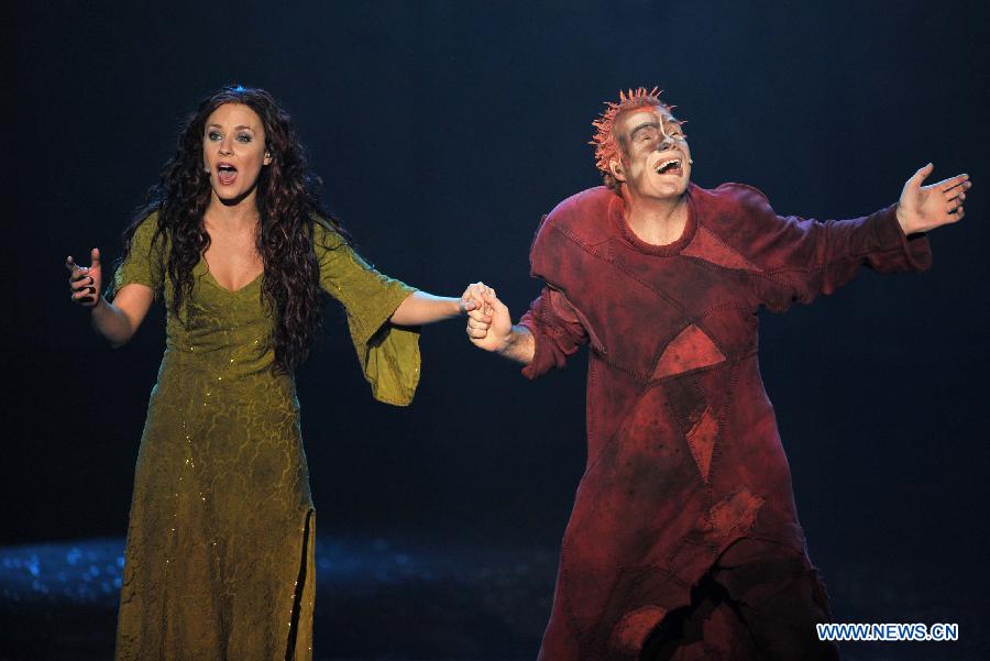 Actors perform during the musical Notre-Dame de Paris at Qingdao Grand Theatre in Qingdao, east China's Shandong Province, Nov. 18, 2012. (Xinhua/Li Ziheng) 