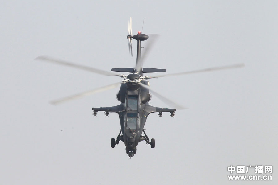 A WZ-10 attack helicopter practices on the first day of Airshow China 2012, which kicked off in south China’s Zhuhai on Nov. 13, 2012, after its first public appearance on Nov. 11, 2012. WZ-10, nicknamed China’s “Apache”, is the most advanced attack helicopter of the PLA and also the most expected Chinese aircraft at the Airshow China 2012. (CNR/Xu Ao)