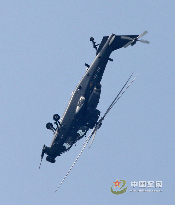 China's independently-developed WZ-10 armed helicopter debuted at the 9th China International Aviation & Aerospace Exhibition in Zhuhai, south China's Guangdong province on November 13, 2012, and showed its good performance in the demonstration. The photo shows that a WZ-10 armed helicopter is making a backward flight at 70 degrees. (chinamil.com.cn/Qiao Tianfu)