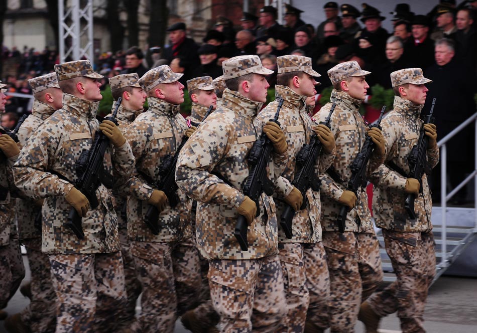 Latvian soldiers are in the military parade to celebrate the 94th anniversary of Latvia’s independent day. (Xinhua/Guo Qun)