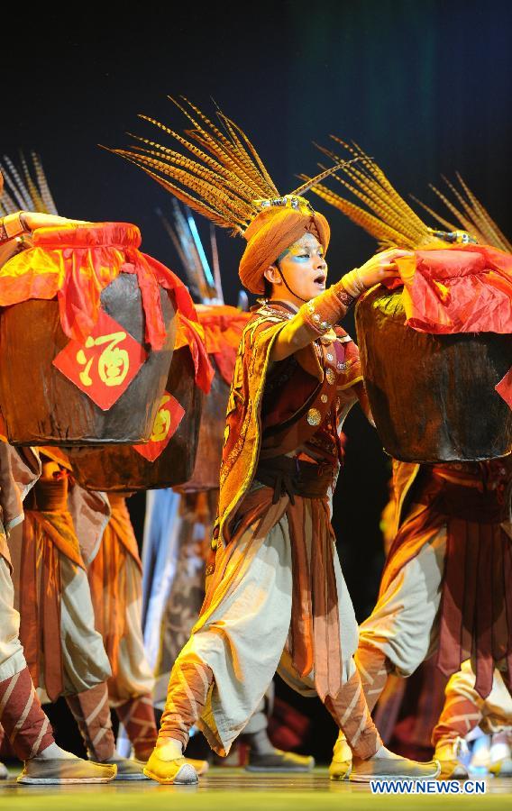 Dancers perform during a dancing show about the tradition of Miao and Dong ethnic groups in Kaili City of Qiandongnan, southwest China's Guizhou Province, Nov. 19, 2012. (Xinhua/Tao Liang) 