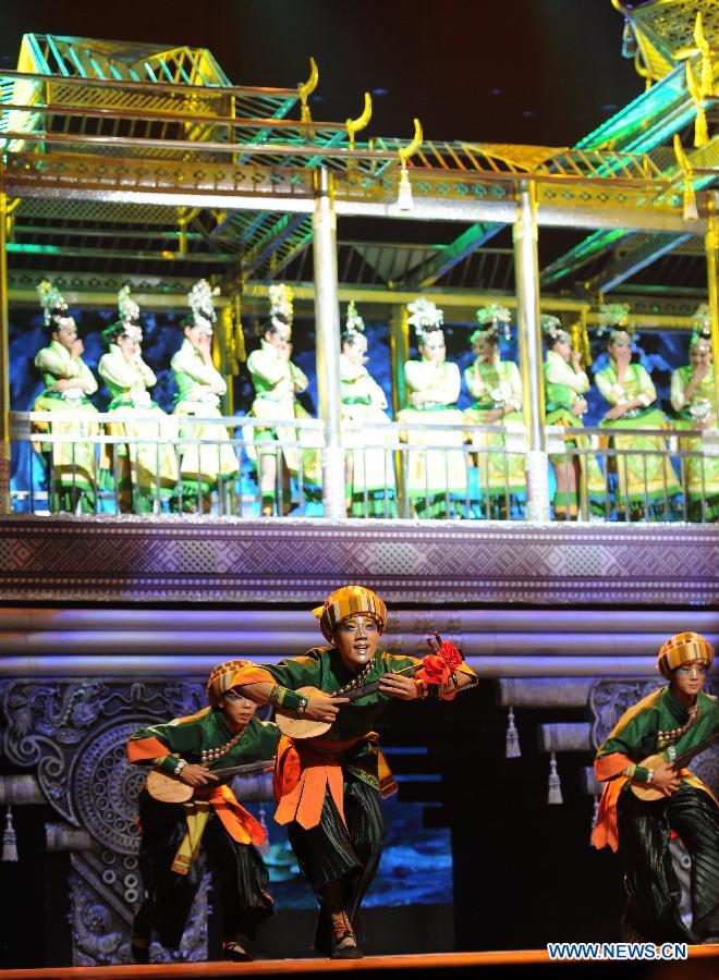 Dancers perform during a dancing show about the tradition of Miao and Dong ethnic groups in Kaili City of Qiandongnan, southwest China's Guizhou Province, Nov. 19, 2012. (Xinhua/Tao Liang) 