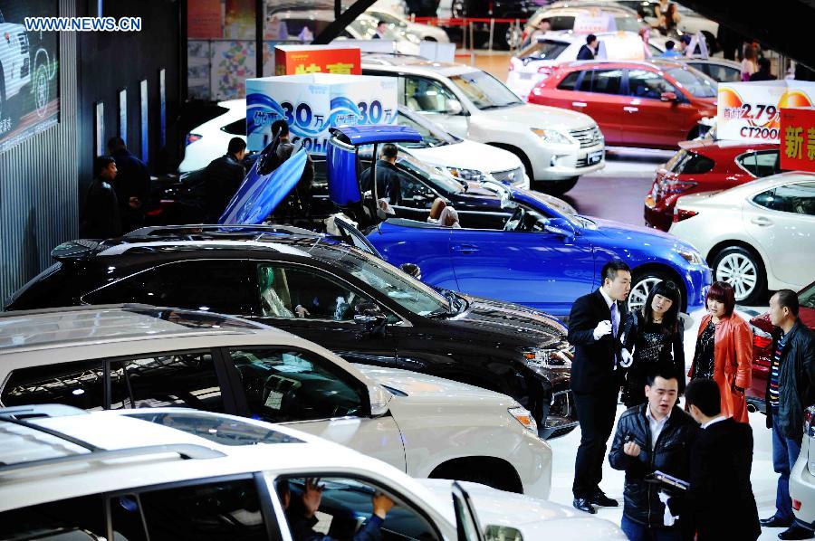 Visitors look around during the 3rd Harbin Autumn Automobile Exhibition in Harbin, capital of northeast China's Heilongjiang Province, Nov. 20, 2012. The week-long exhibition, as well as the 10th Harbin automobile purchasing week, kicked off on Tuesday.(Xinhua/Wang Jianwei)