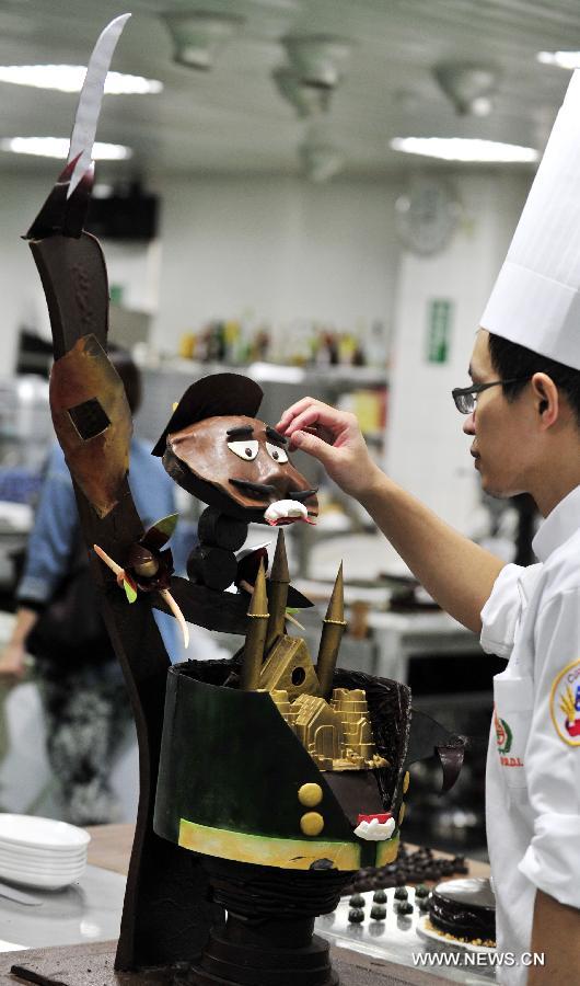 A contestant makes his creation at a qualifying test for the World Chocolate Masters (WCM) competition in Taipei, southeast China's Taiwan, Nov. 20, 2012. The winner of the qualifying test in Taiwan will also compete with counterparts from Chinese Mainland, Australia and Singapore in 2013, who will strive for the qualification within the scope of Asian-Pacific region to take part in the WCM competition. (Xinhua/Wu Ching-teng) 