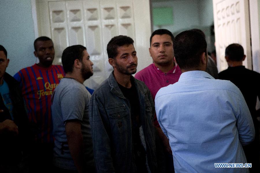 Palestinians react after they checked the body of their family member killed in an Israeli air strike, at Al-Adwan Hospital in Gaza City, Nov. 20, 2012. Hamas-run Ministry of Health said the death toll since Wednesday in the Gaza Strip has climbed to 130 and more than 1,000 people were wounded in the ongoing Israeli aerial operation on the coastal enclave. (Xinhua/Chen Xu) 