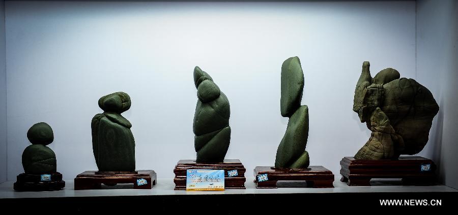 Photo taken on Nov. 19, 2012 shows the artworks made of Songhua stones in the Songhua Stone Museum in Jiangyuan District of Baishan City, northeast China's Jilin Province. Baishan City is known as the hometown of Songhua stones. (Xinhua/Xu Chang) 