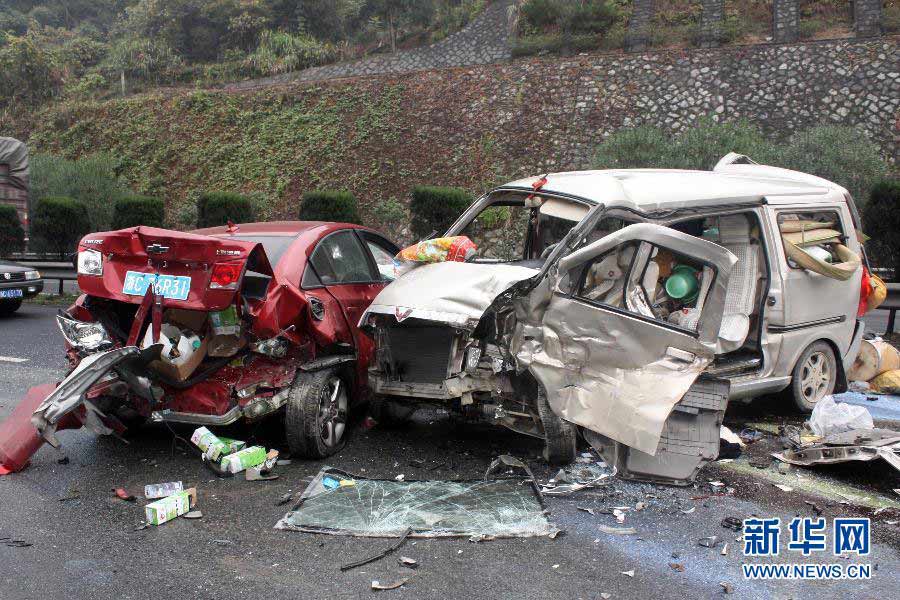 Rescuers work at the scene of a vehicle pileup on the Shenyang-Haikou Expressway in Fuding, southeast China's Fujian Province, Nov. 22, 2012. Five people have died and two others were injured in a pileup involving five vehicles in the Fuding section of the Shenyang-Haikou Expressway on Thursday morning. The two injured people were carrying slight injuries and sent to hospital. (Xinhua/Huang Jianhong)