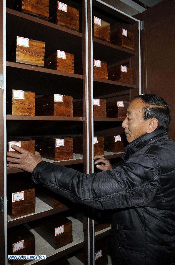 Photo taken on Nov. 21, 2012 shows the Palm-Leaf Manuscripts of Buddhist Sutras preserved at the museum in Lhasa, capital of southwest China's Tibet Autonomous Region. The palm-leaf manuscripts of Buddhist sutras have been well preserved in China. Palm-Leaf sutras refer to the Buddhist classics inscribed on the leaves of palm trees. The practice originated in India and was introduced into China more than 1,000 years ago during the Tang Dynasty (618-907).(Xinhua/Chogo)