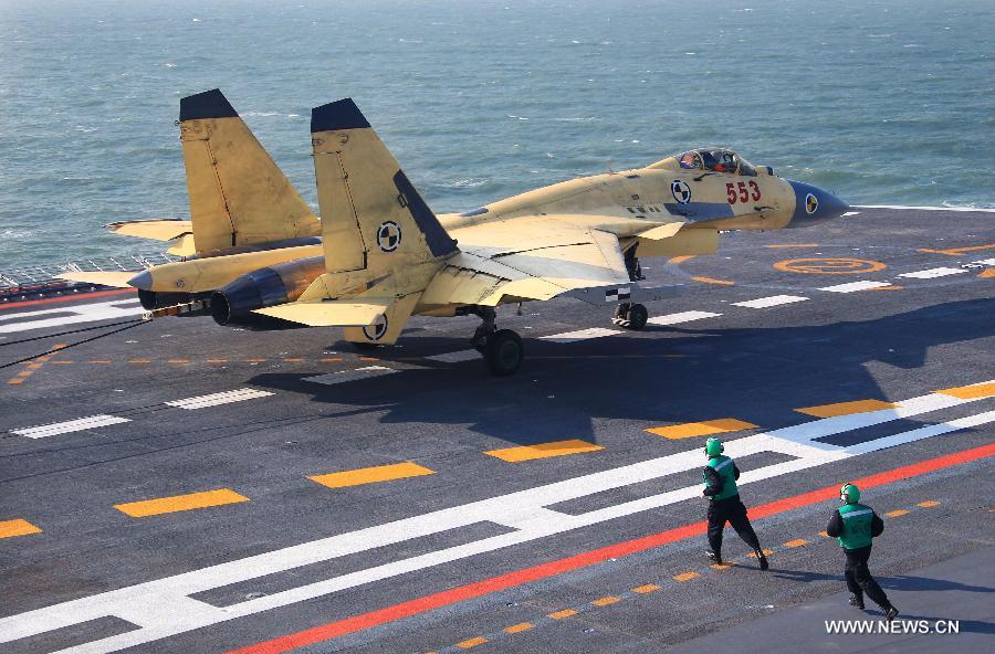 This undated photo shows a carrier-borne J-15 fighter jet landing on China's first aircraft carrier, the Liaoning. (Xinhua/Zha Chunming) 