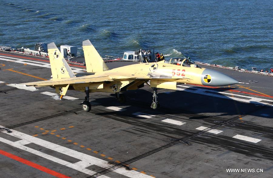 This undated photo shows a carrier-borne J-15 fighter jet landing on China's first aircraft carrier, the Liaoning. (Xinhua/Zha Chunming) 