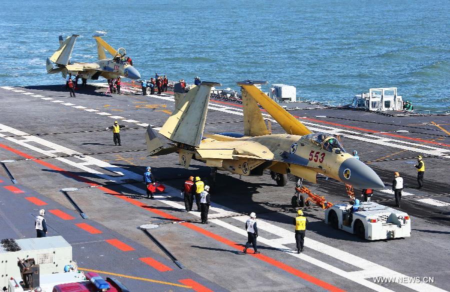 This undated photo shows two carrier-borne J-15 fighter jets on China's first aircraft carrier, the Liaoning. (Xinhua/Zha Chunming) 