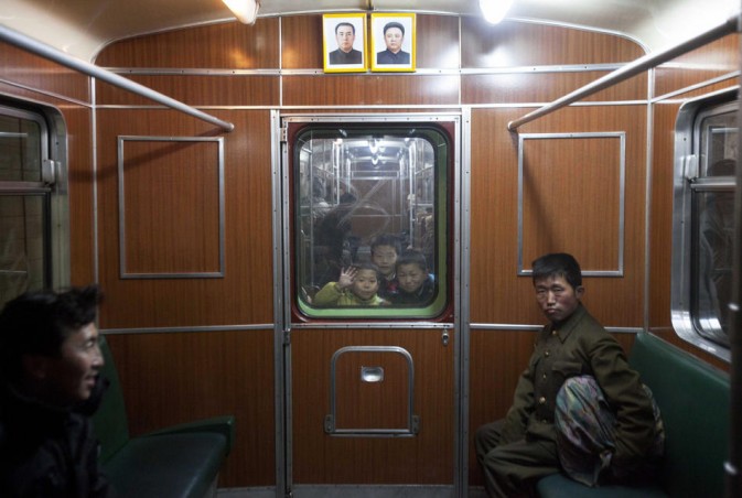 Children look towards the lens through a carriage window.(Photo/Xinhua)