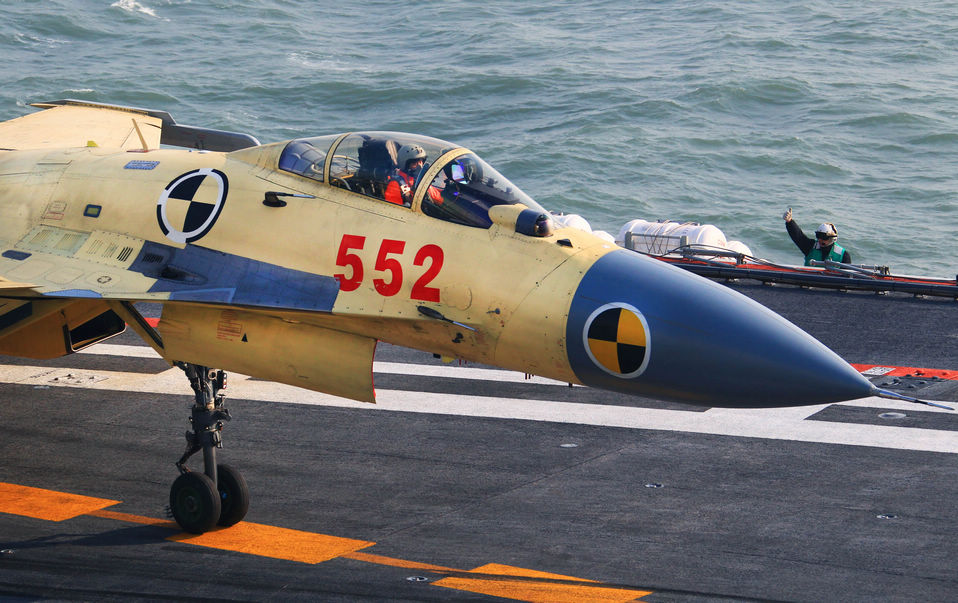 A J-15 fighter jet prepares to take off from China's first aircraft carrier, the Liaoning.(Xinhua/Cha Chunming)