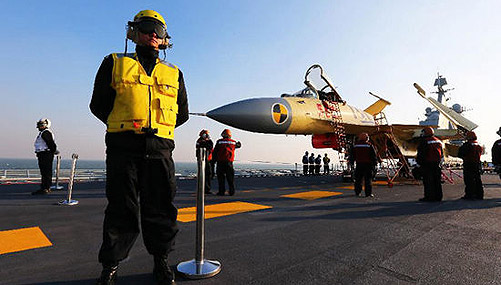 China conducts flight landing on aircraft carrier