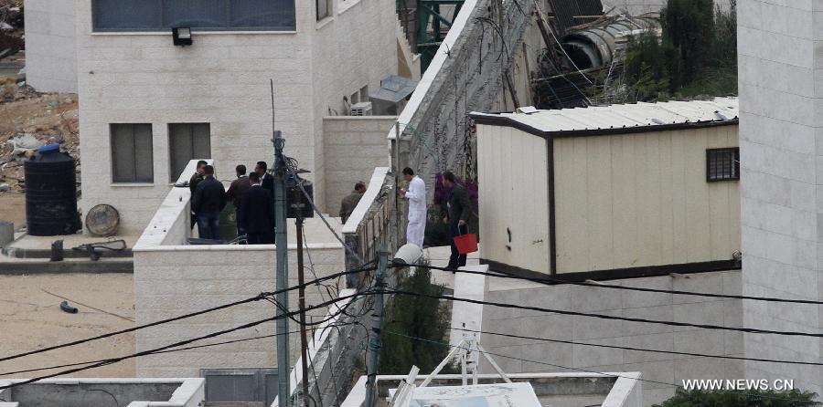 Staff members are seen around the mausoleum of the late Palestinian leader Yasser Arafat in the West Bank city of Ramallah, Nov. 27, 2012. Samples of the remains of iconic Palestinian leader Yasser Arafat were exhumed so experts could search for additional clues to his death, Palestinian officials said.(Xinhua/Ayman Nobani)