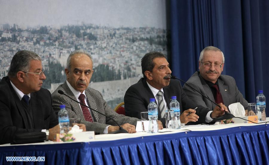 The Palestinian committee to probe the circumstances of Arafat's death holds a press conference in the West Bank City of Ramallah on Nov. 27, 2012. Earlier Tuesday, the Palestinian National Authority (PNA) finalized digging up the remains of Arafat, as Russian, Swiss and French experts took samples of the remains to inspect the reason behind his death. (Xinhua/Ayman Nobani)