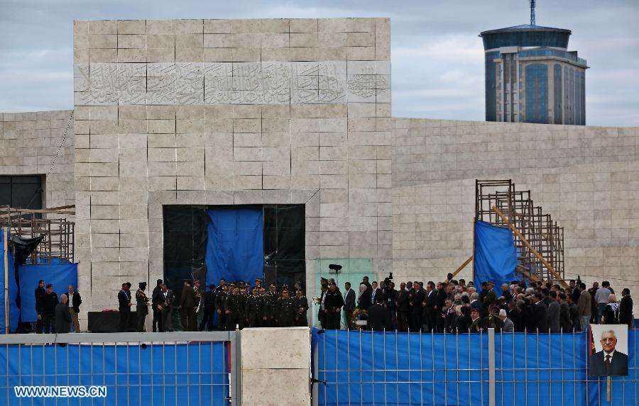 Members of an honour guard stand outside the mausoleum housing late Palestinian President Yasser Arafat, in the West Bank city of Ramallah, on Nov. 27, 2012. Earlier Tuesday, the PNA finalized digging up the remains of Arafat, as Russian, Swiss and French experts took samples of the remains to inspect the reason behind his death. (Xinhua/Ayman Nobani)