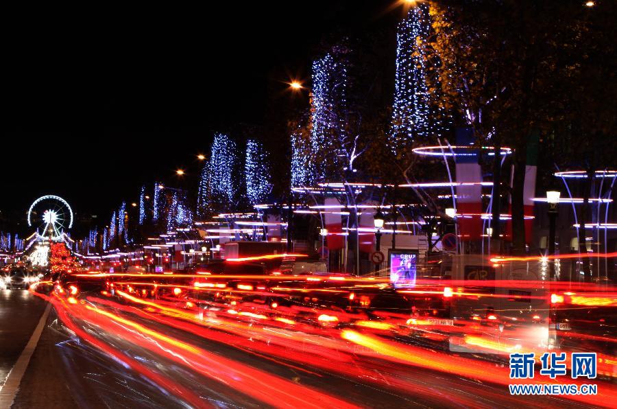 The Champs Elysees is decorated by illuminations in Paris, capital of France, on Nov. 21, 2012, which marks opening of Christmas Season in Paris. (Xinhua/Gao Jing)