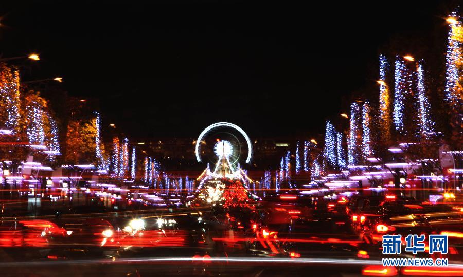 The Champs Elysees is decorated by illuminations in Paris, capital of France, on Nov. 21, 2012, which marks opening of Christmas Season in Paris. (Xinhua/Gao Jing)