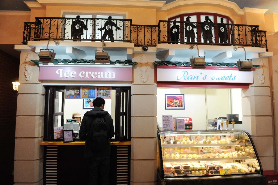 Customers do shopping at Detective-Conan-themed Lawson convenience store in Shanghai, east China, Nov.28, 2012. The store which was designed and constructed according to the scene of the Japanese cartoon Detective Conan, opened to the public in Shanghai on Wednesday. (Xinhua/Lai Xinlin) 