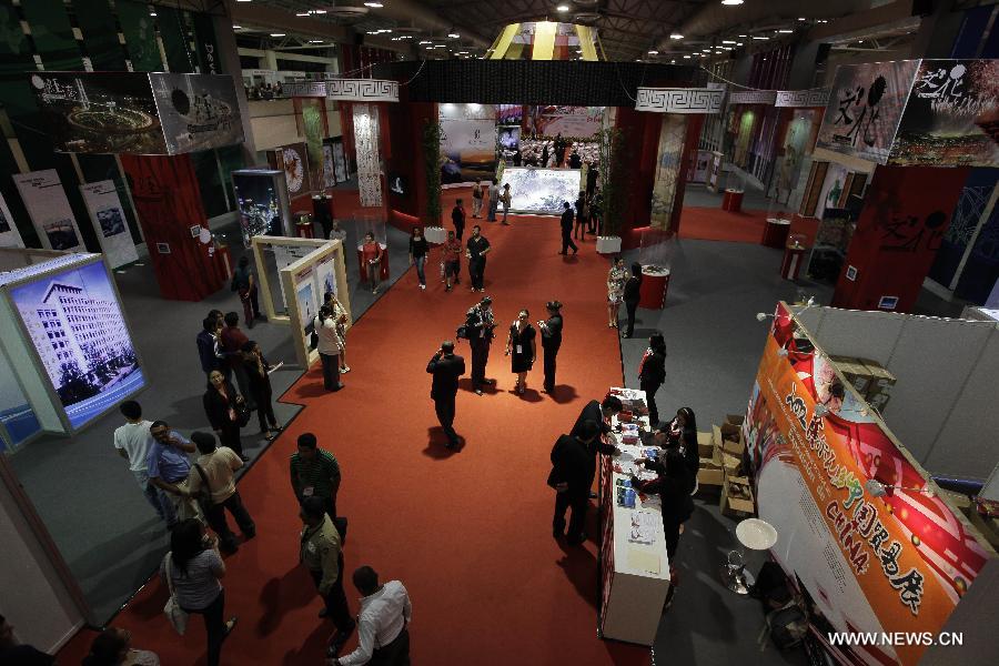 People visit the Second Chinese Trade Exhibition at the International Center for Fairs and Conventions, in San Salvador, capital of El Salvador, on Nov. 28, 2012. China organized for the second time a trade fair, in which 40 companies showed different products in three days. (Xinhua/Oscar Rivera)