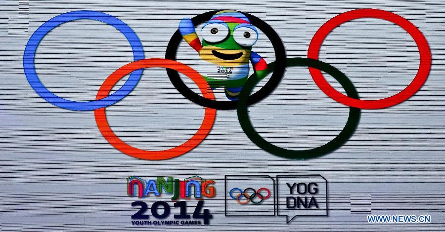 Lele, 2014 Summer Youth Olympics' mascot, is shown on a screen with the Olympic Rings in Nanjing, east China's Jiangsu Province on Nov. 29, 2012. The creature was unveiled as the mascot for the 2014 Summer Youth Olympics here Thursday. (Xinhua/Yang Lei) 