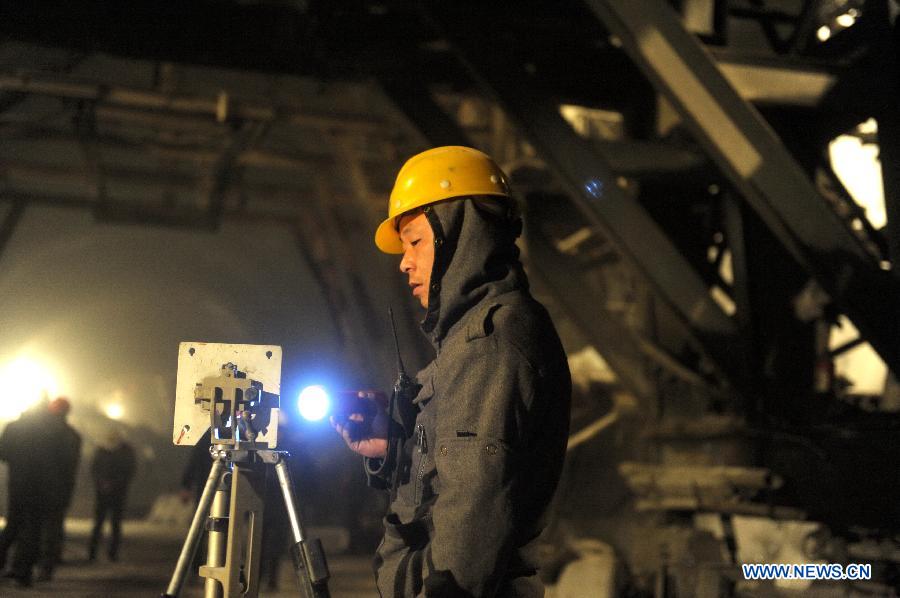 A technician works in the Zhaobishan Tunnel of the second line of Lanxin (Lanzhou-Xinjiang) Railway in Datong County, northwest China's Qinghai Province, Nov. 27, 2012. 