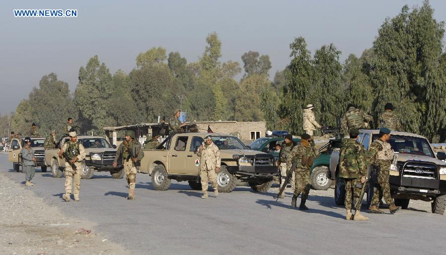 Afghan soldiers are seen at the site of an attack in Nangarhar Province, Afghanistan, on Dec. 2, 2012. At least 11 people were killed when several Taliban militants armed with suicide vests and weapons stormed an Afghan-NATO base in Jalalabad, the capital city of Afghanistan's eastern province of Nangarhar Sunday morning. (Xinhua/Tahir Safi)