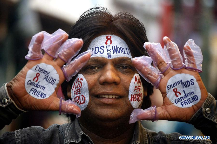 A social activist attends a campaign to mark the World AIDS Day in Bhopal, India, Dec. 1, 2012. The World AIDS Day which is annually observed on Dec. 1, is dedicated to raising awareness of the AIDS pandemic caused by the spread of HIV infection. (Xinhua/Stringer)